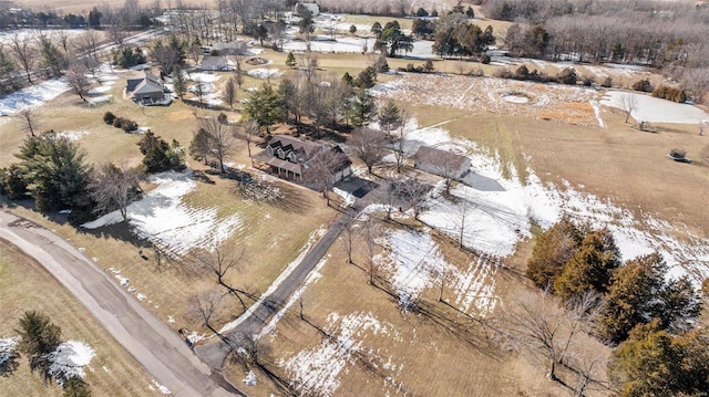 snowy aerial view featuring a rural view