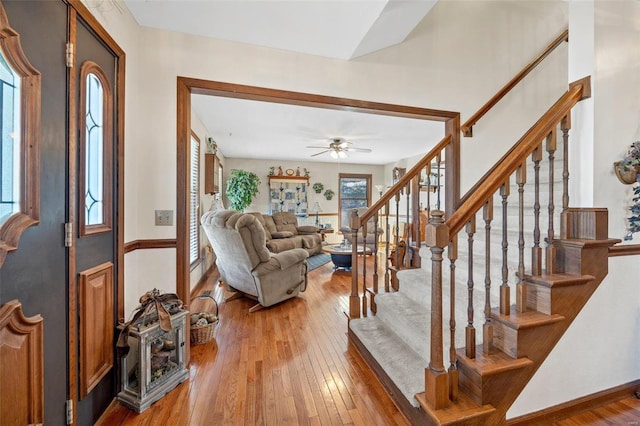 interior space with wood-type flooring and ceiling fan