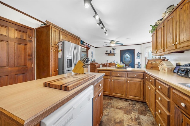 kitchen with dishwasher, ceiling fan, stainless steel refrigerator with ice dispenser, track lighting, and kitchen peninsula