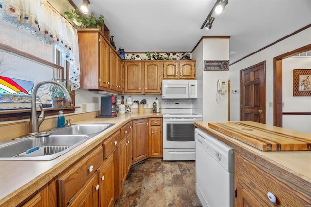 kitchen with sink and white appliances