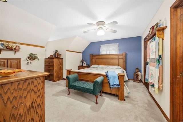 carpeted bedroom featuring ceiling fan and lofted ceiling