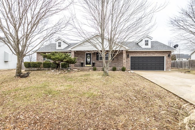 view of front facade featuring a garage and a front lawn