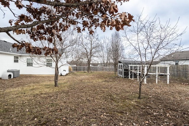 view of yard with an outbuilding and central AC unit