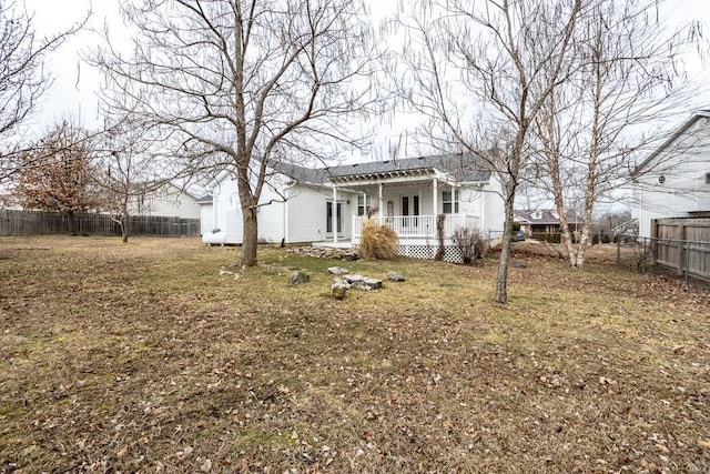 exterior space with a porch and a lawn