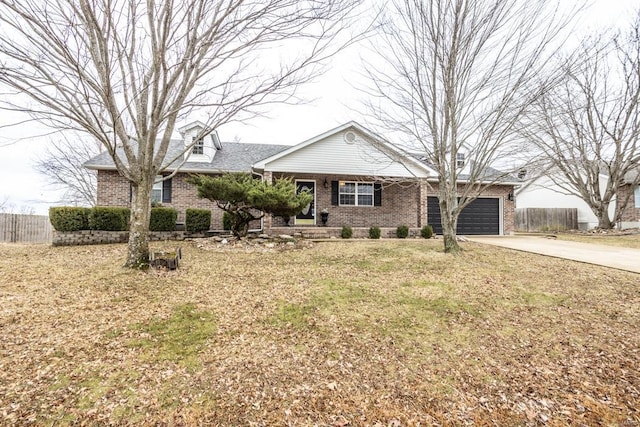 single story home featuring a garage and a front lawn