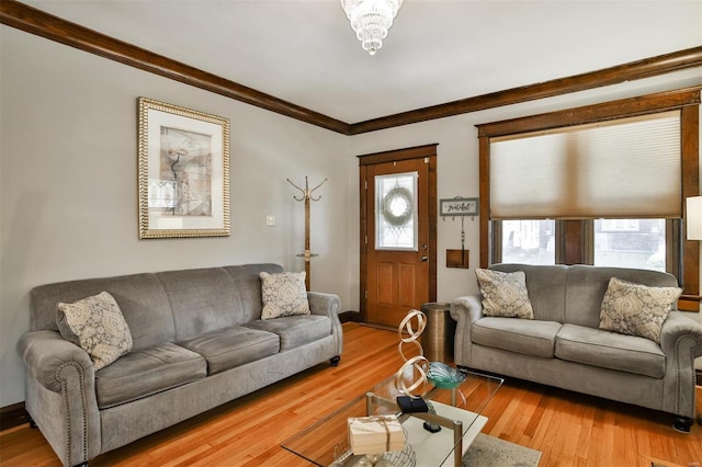 living room featuring crown molding and wood finished floors