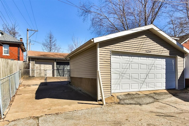 detached garage with fence