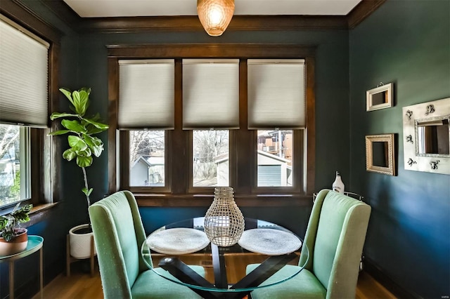 dining area with crown molding