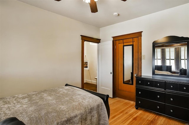 bedroom featuring light wood-type flooring and a ceiling fan