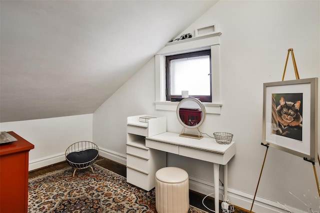 office area with lofted ceiling, wood finished floors, and baseboards