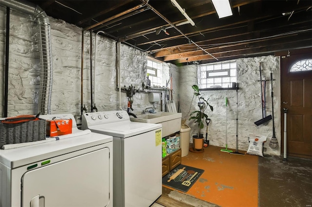 laundry room featuring a sink, laundry area, and washing machine and clothes dryer