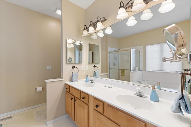 full bath featuring double vanity, a stall shower, visible vents, and a sink