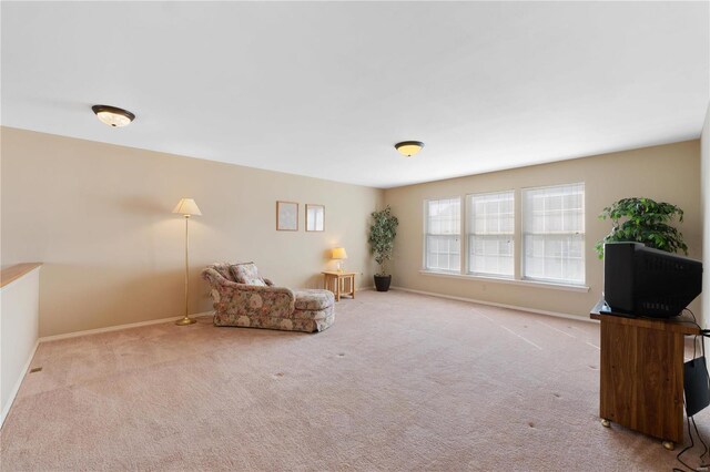 unfurnished room with carpet floors and baseboards