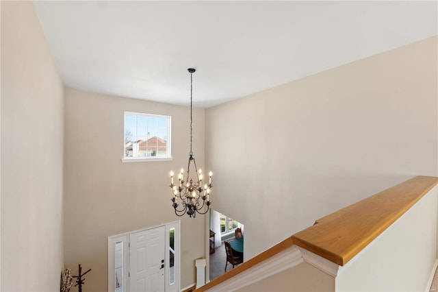 entryway with an inviting chandelier