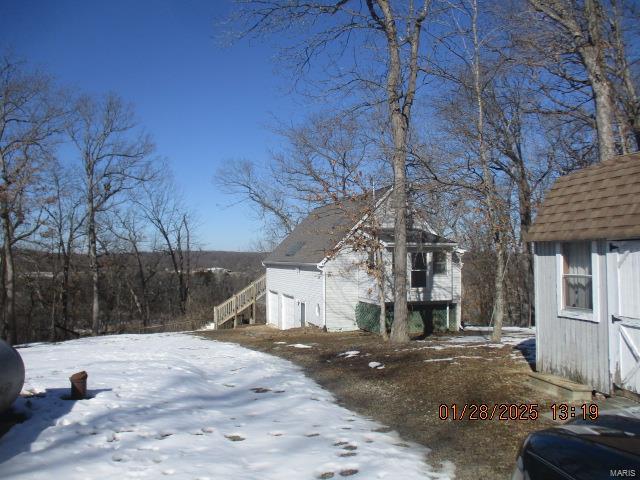 view of snow covered property