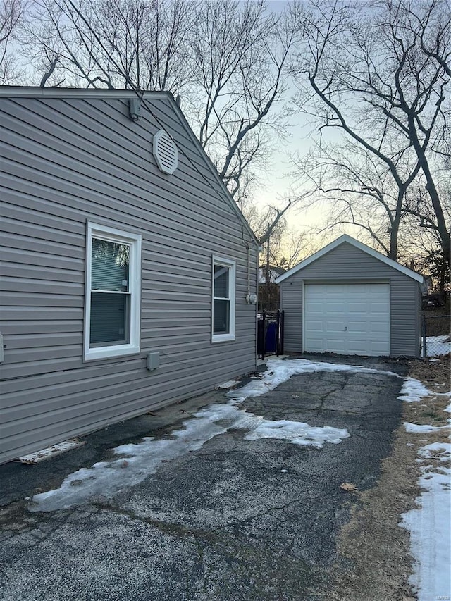 view of side of property with an outbuilding and a garage