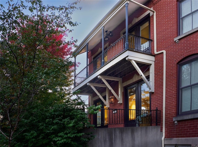 rear view of property featuring a balcony