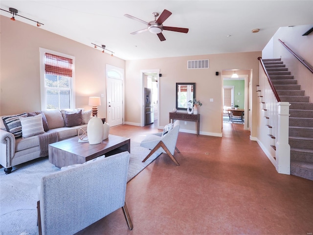 living room featuring ceiling fan and track lighting