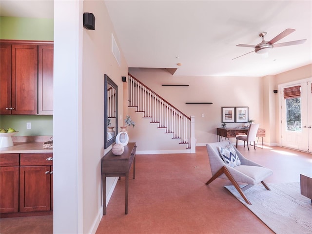 interior space with ceiling fan