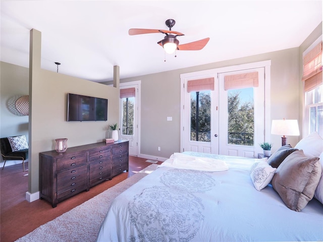 bedroom with ceiling fan, access to outside, and dark carpet