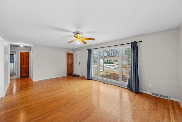 spare room with ceiling fan and light hardwood / wood-style floors