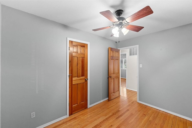 unfurnished bedroom featuring ceiling fan and light hardwood / wood-style floors