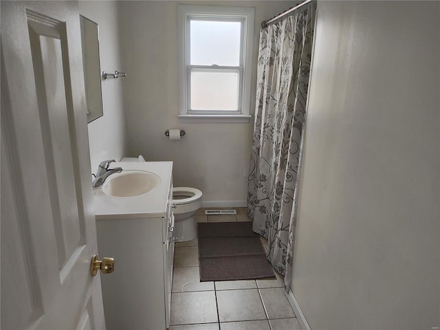 bathroom with tile patterned floors, a shower with curtain, toilet, and vanity