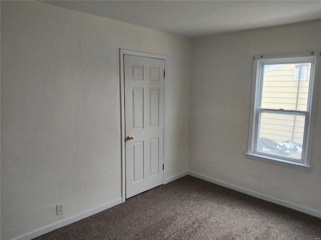 carpeted empty room featuring a healthy amount of sunlight