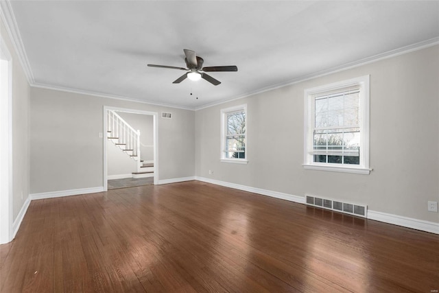 spare room featuring ornamental molding, dark wood-type flooring, and ceiling fan