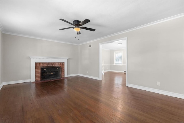 unfurnished living room with crown molding, a brick fireplace, dark wood-type flooring, and ceiling fan