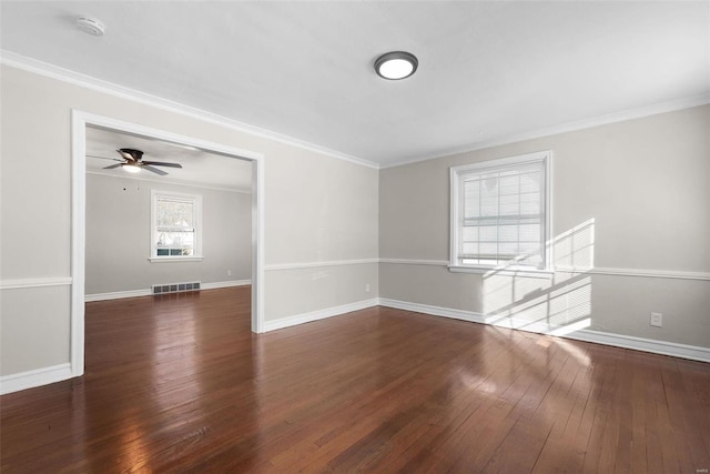 unfurnished room featuring crown molding, dark hardwood / wood-style floors, and ceiling fan