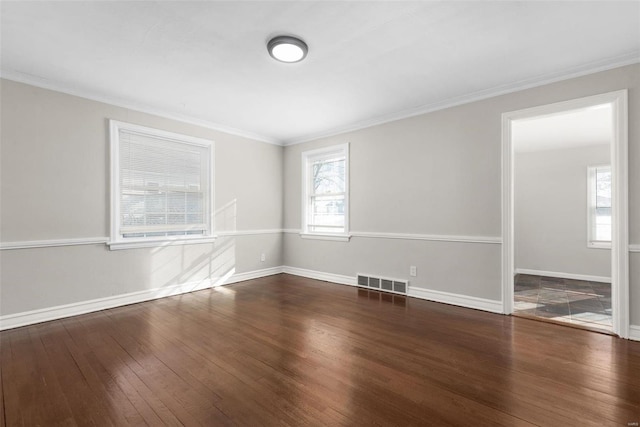 unfurnished room featuring crown molding and dark wood-type flooring