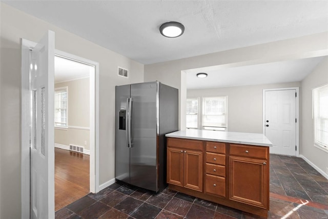 kitchen with stainless steel refrigerator with ice dispenser