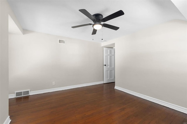 empty room featuring dark hardwood / wood-style flooring and ceiling fan