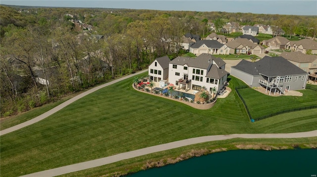 birds eye view of property featuring a water view and a residential view