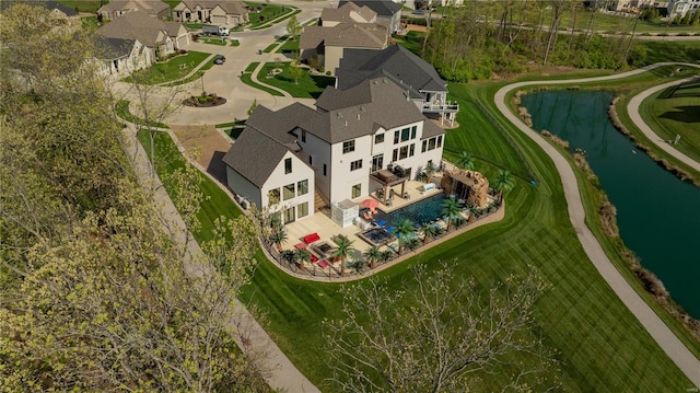 aerial view with a water view and a residential view