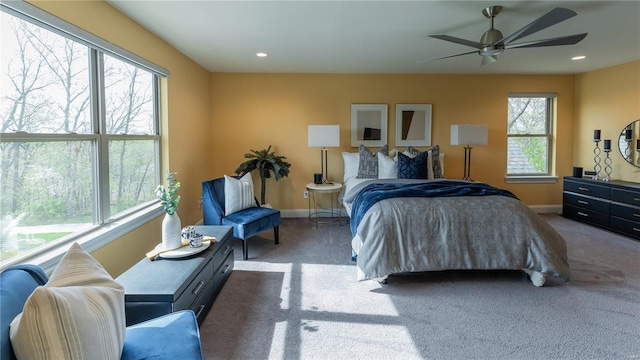 carpeted bedroom featuring baseboards, recessed lighting, and a ceiling fan