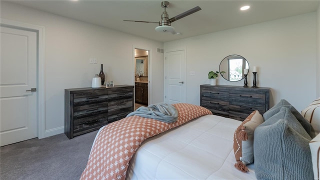 carpeted bedroom featuring baseboards, a ceiling fan, recessed lighting, and ensuite bath