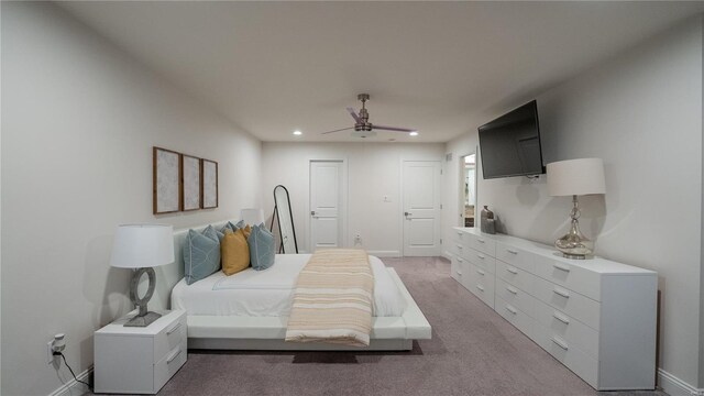 bedroom with recessed lighting, baseboards, light carpet, and a ceiling fan