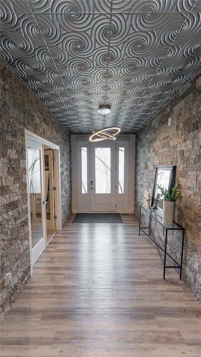 interior space with an ornate ceiling and light wood-type flooring