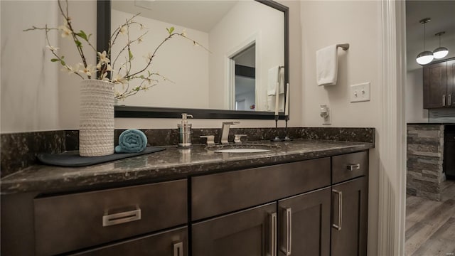 bathroom featuring vanity and wood finished floors