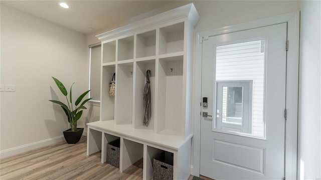 mudroom featuring recessed lighting, baseboards, and light wood-type flooring