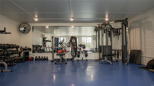 exercise room with brick wall