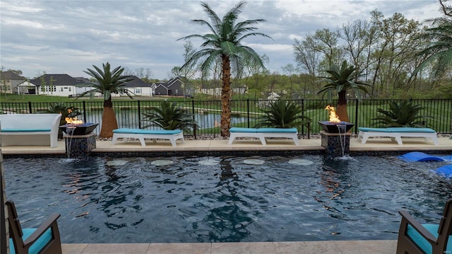 view of pool with a fenced in pool, fence, a patio area, and a residential view