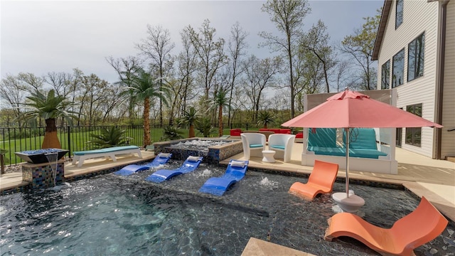 view of playground with a patio, an in ground hot tub, and fence