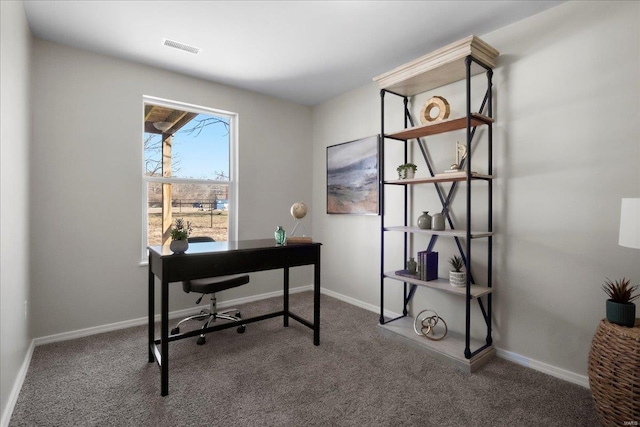 home office with carpet, visible vents, and baseboards