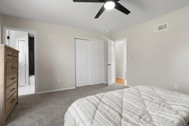 bedroom featuring a closet, carpet, visible vents, and baseboards