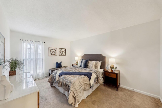 carpeted bedroom featuring a textured ceiling