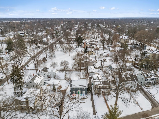 snowy aerial view featuring a residential view