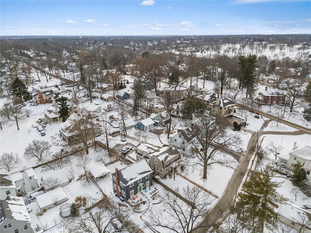 snowy aerial view featuring a residential view